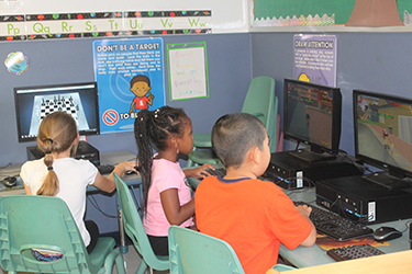 Kids at the Bright Futures Early Scholars Academy Computer Lab